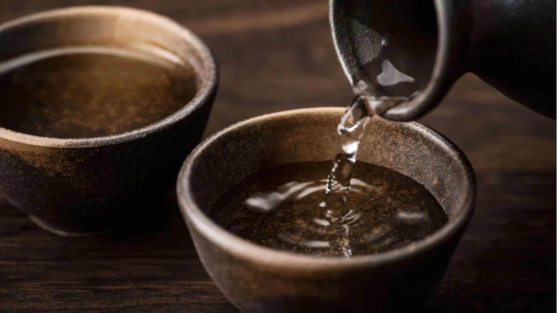 Sake being poured into a cup